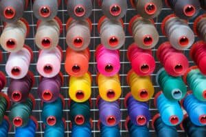 colorful embroidery thread spool using in garment industry, row